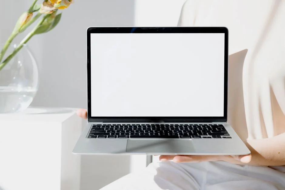 A contemporary workspace showcasing a laptop, tablet, and smartphones, ideal for tech and freelance use.